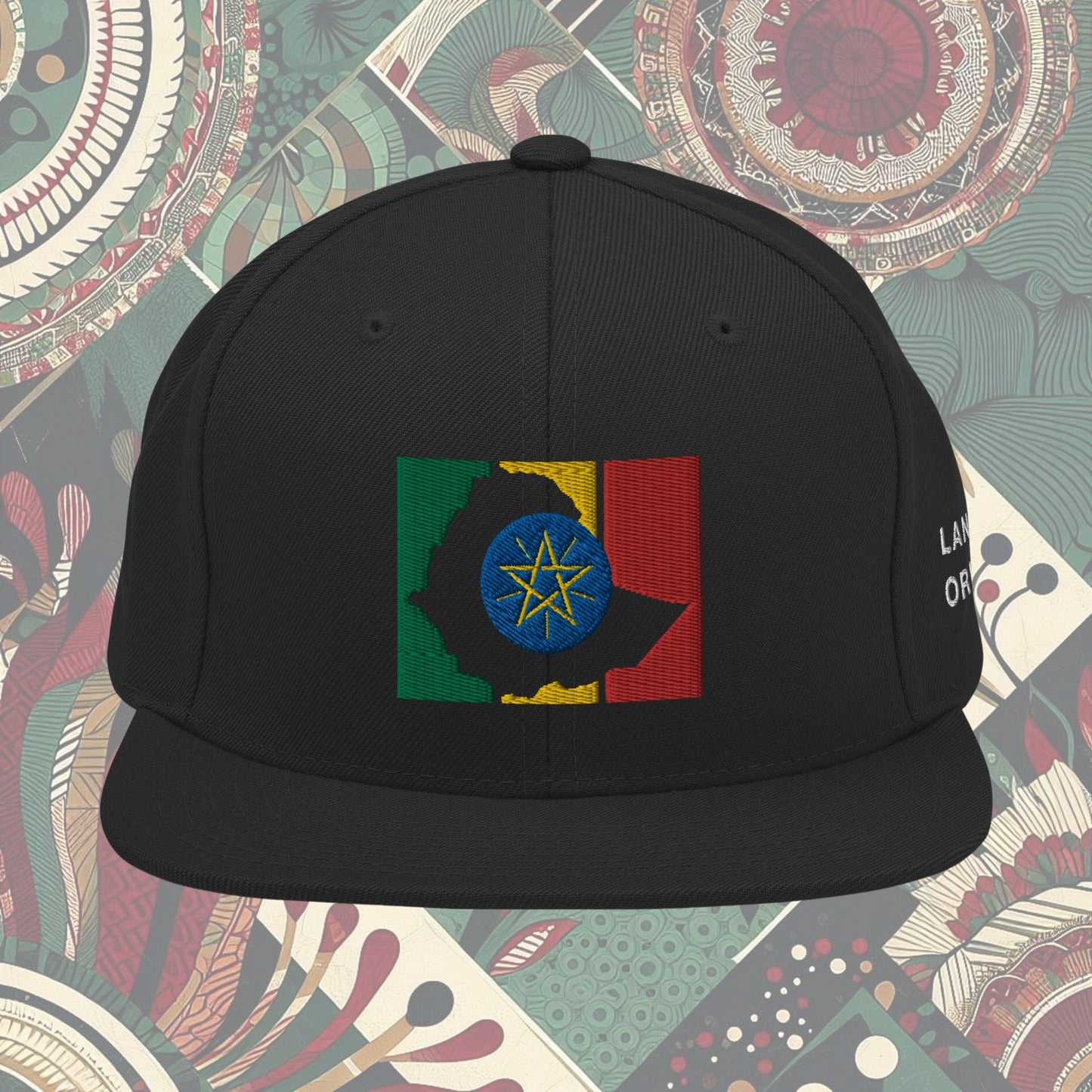 Black Ethiopia flag snapback from a Black-owned business with 'Land of Origin' on the side. Features vibrant flag colors. Perfect for showing national pride. Available now.