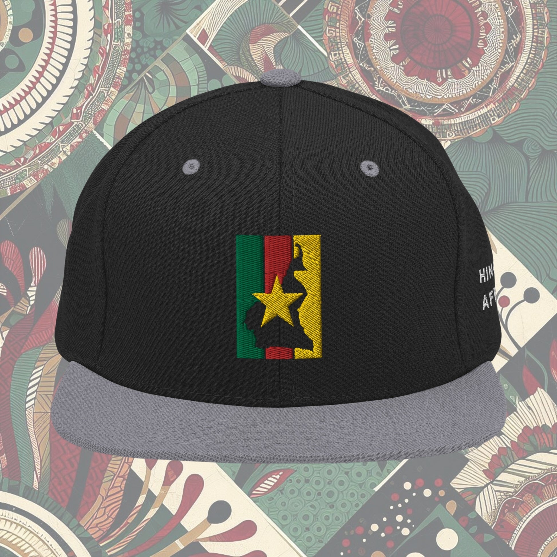 Cameroonian flag snapback from a Black-owned business with 'Hinge of Africa' on the side. Features vibrant green, red, and yellow colors with a central yellow star. Perfect for showing national pride and supporting Black-owned businesses. Available now.