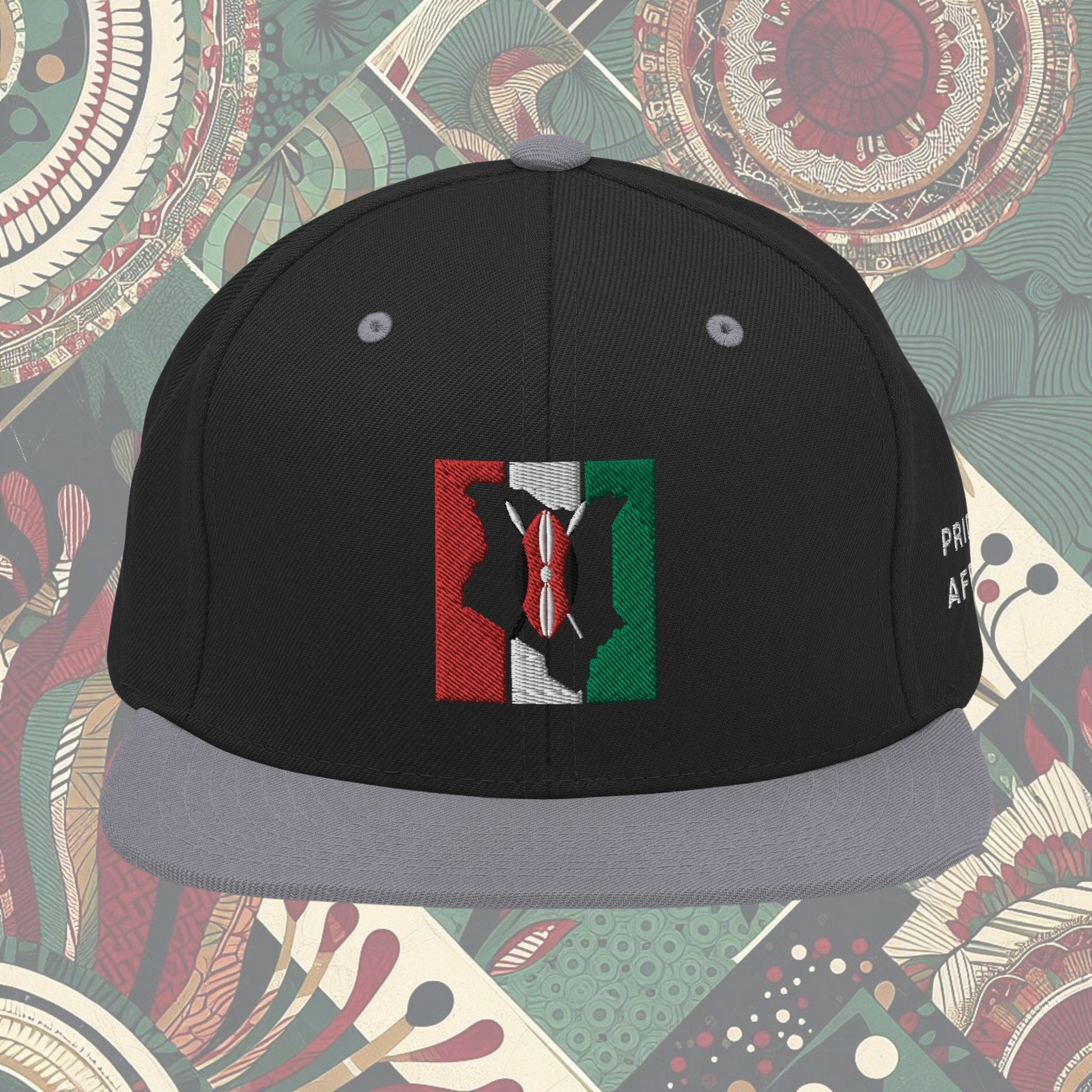 Grey brim Kenya flag snapback with 'Pride of Africa' written on the side. Features vibrant flag colors and a bold statement. Ideal for showcasing pride and enhancing your style.