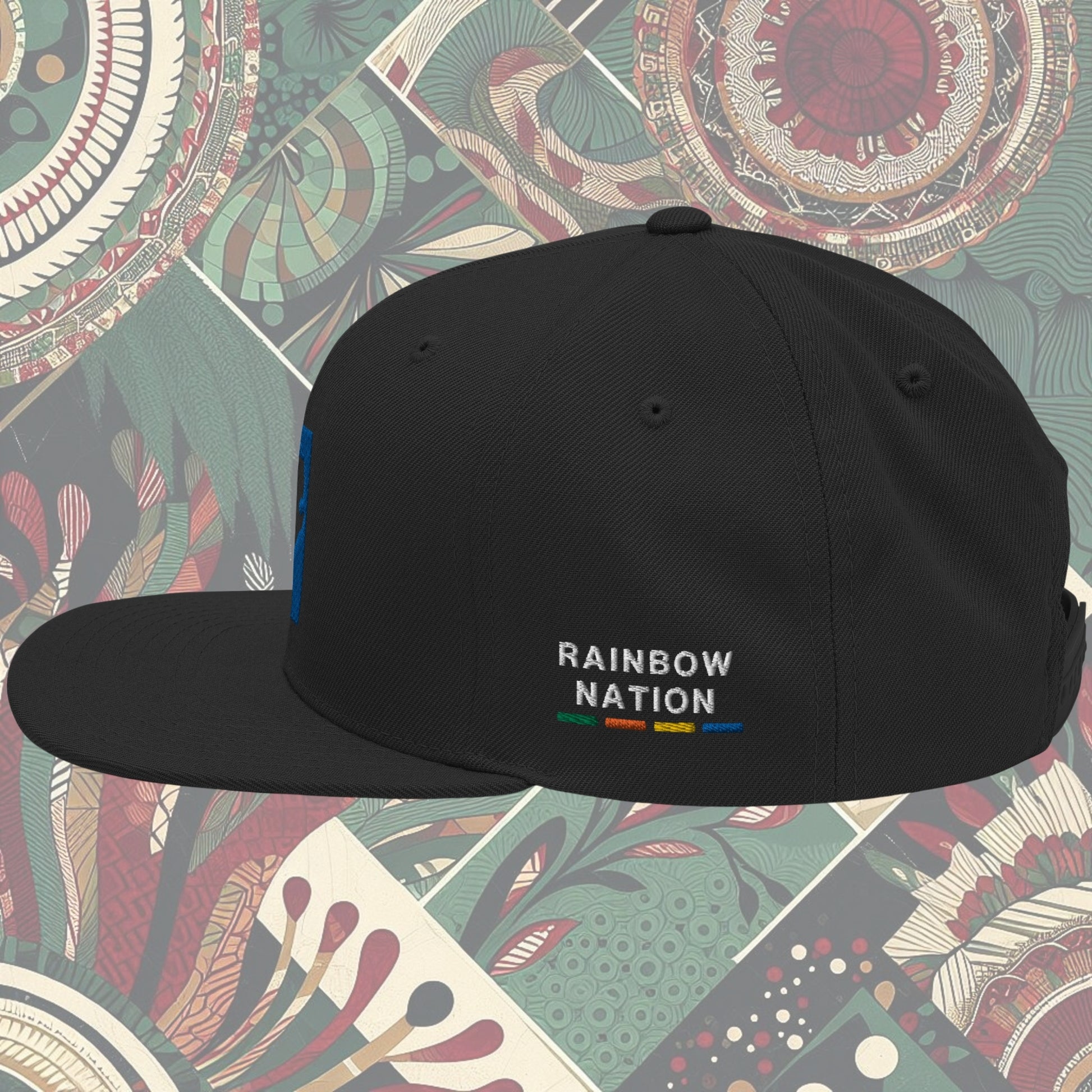 Black South Africa flag snapback with 'Rainbow Nation' written on the side. Features vibrant flag colors and a statement celebrating South Africa's diversity. Ideal for showcasing pride and enhancing your style.