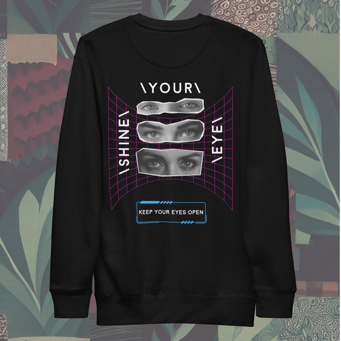 back of Sweatshirt featuring 'SYE' on the front and 'Shine Your Eye', keep your eyes open on the back, with magazine cut-out eyes and neon streetwear design elements. Bold and edgy, perfect for a standout style.