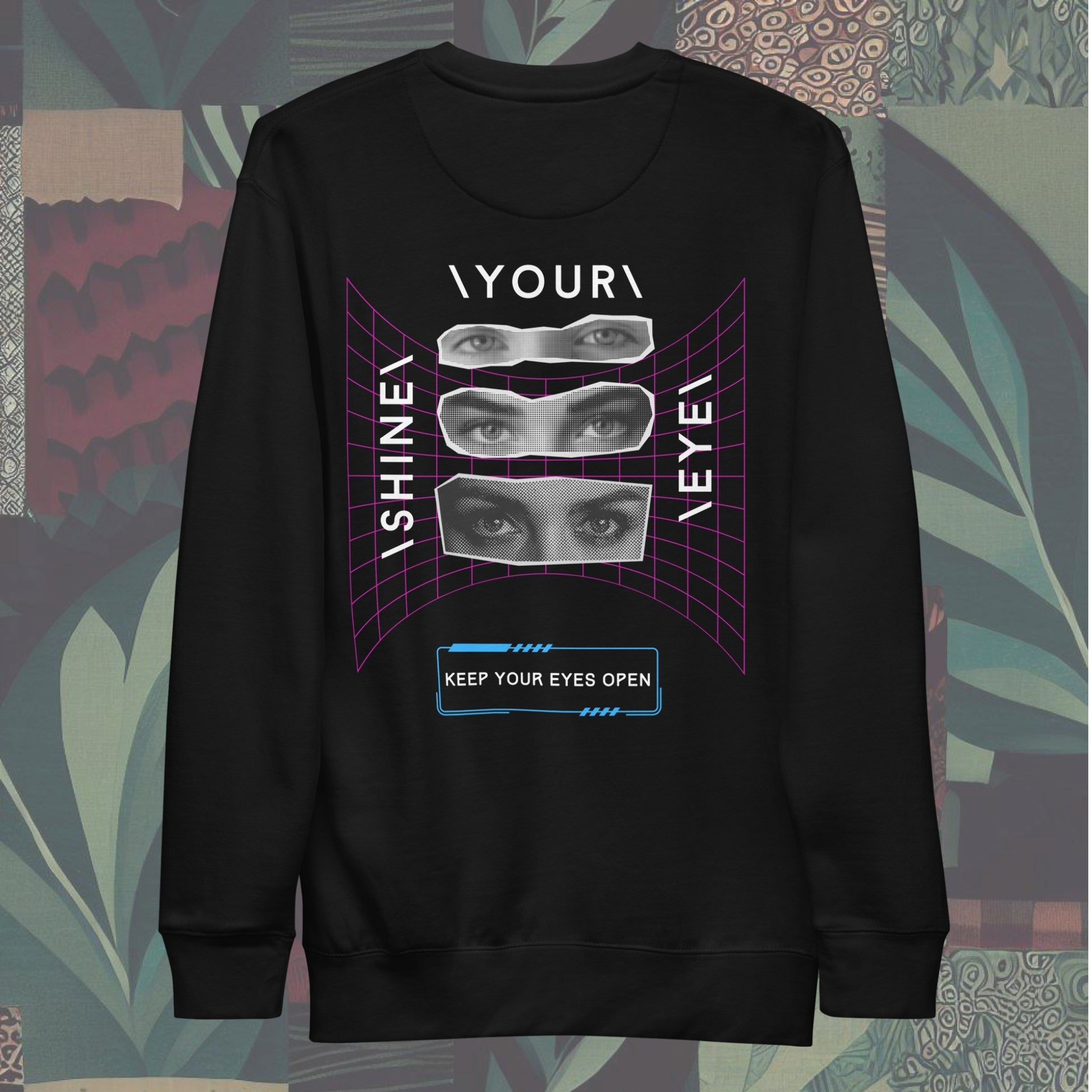 back of Sweatshirt featuring 'SYE' on the front and 'Shine Your Eye', keep your eyes open on the back, with magazine cut-out eyes and neon streetwear design elements. Bold and edgy, perfect for a standout style.