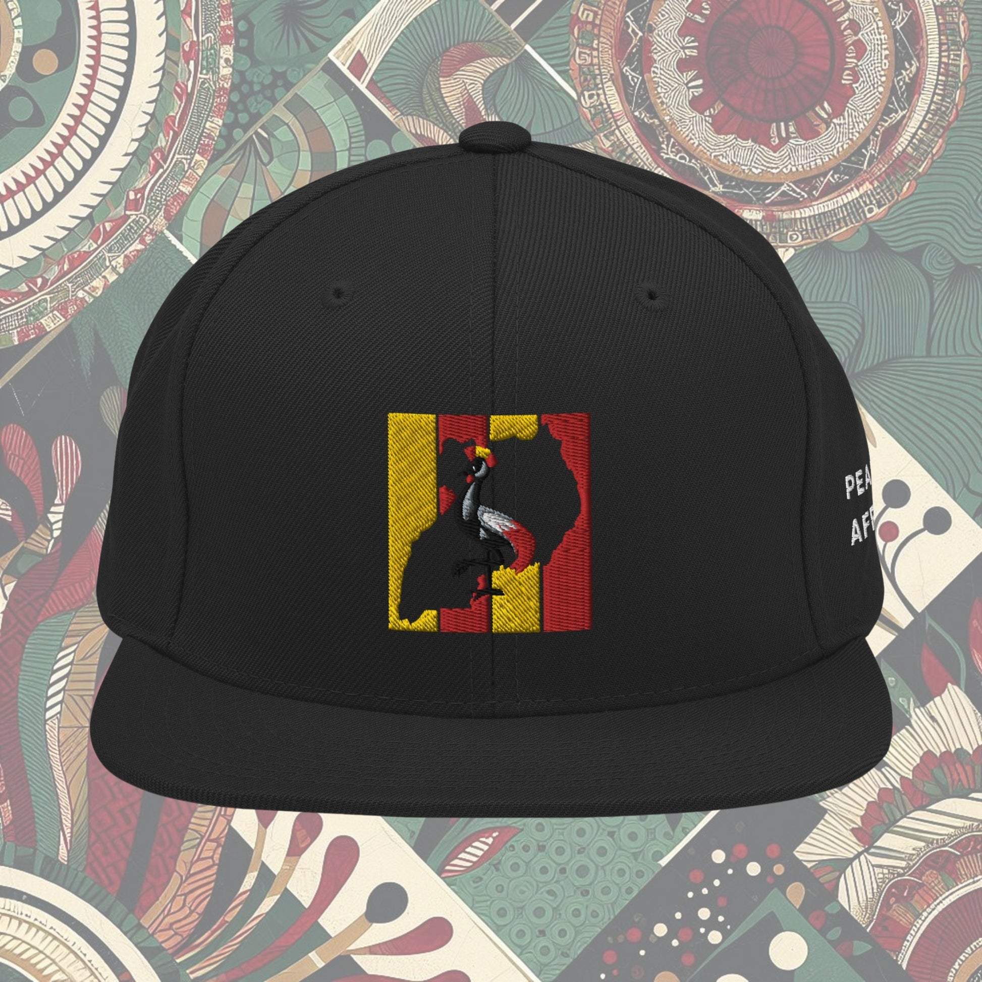 Black Uganda flag snapback with 'Pearl of Africa' written on the side. Vibrant flag colors and a stylish statement piece for showing pride and supporting unique fashion