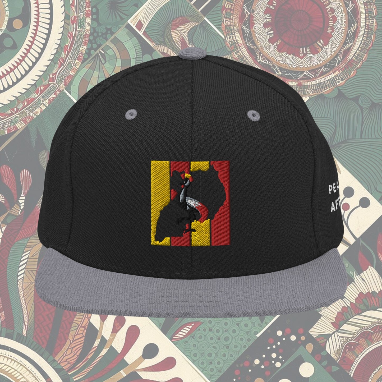grey brim Uganda flag snapback with 'Pearl of Africa' written on the side. Vibrant flag colors and a stylish statement piece for showing pride and supporting unique fashion