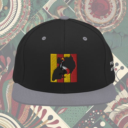 grey brim Uganda flag snapback with 'Pearl of Africa' written on the side. Vibrant flag colors and a stylish statement piece for showing pride and supporting unique fashion