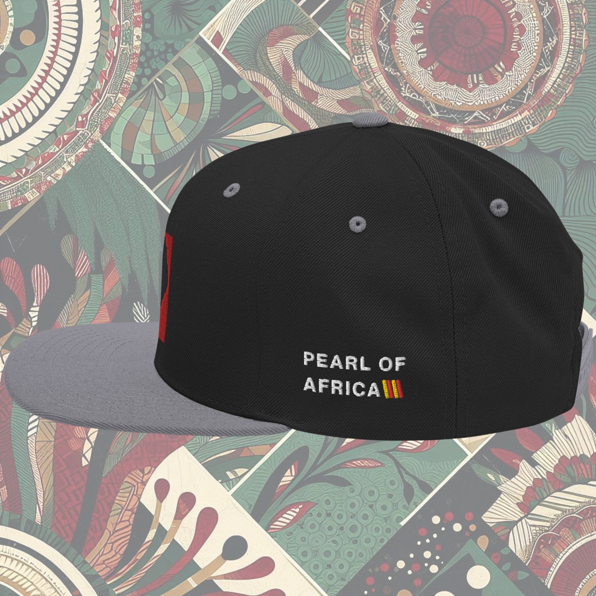 grey brim Uganda flag snapback with 'Pearl of Africa' written on the side. Vibrant flag colors and a stylish statement piece for showing pride and supporting unique fashion